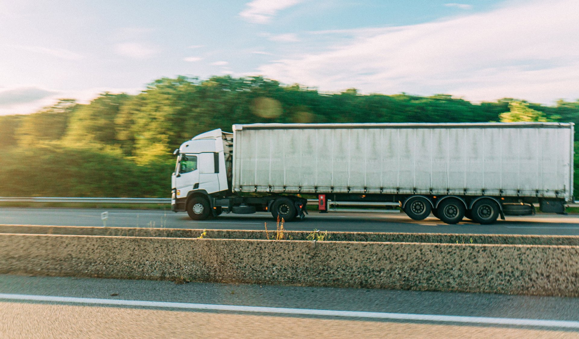 a white truck on a road