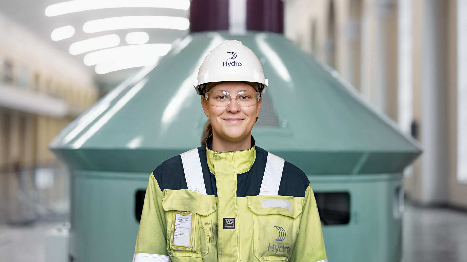 a person wearing a hard hat and safety vest
