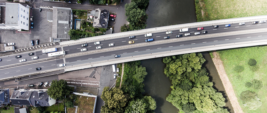 River and highway crossing a town, aerial view