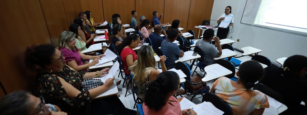 a group of people sitting in a classroom
