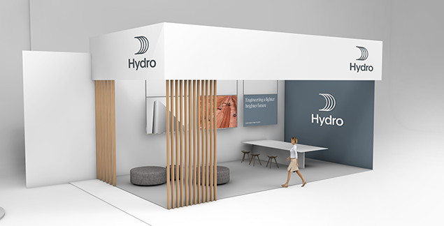 front left view of exhibition booth with white canopy and walls, dark blue short wall with white logo. Clean furnishings.