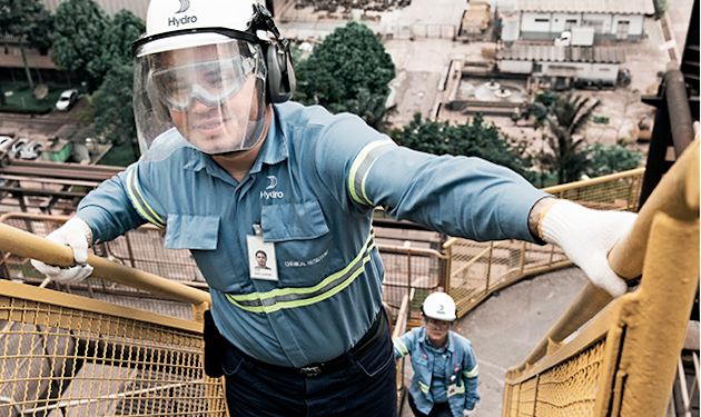 a man wearing a helmet and holding a stick