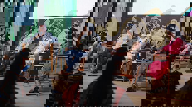 a group of people sitting in chairs