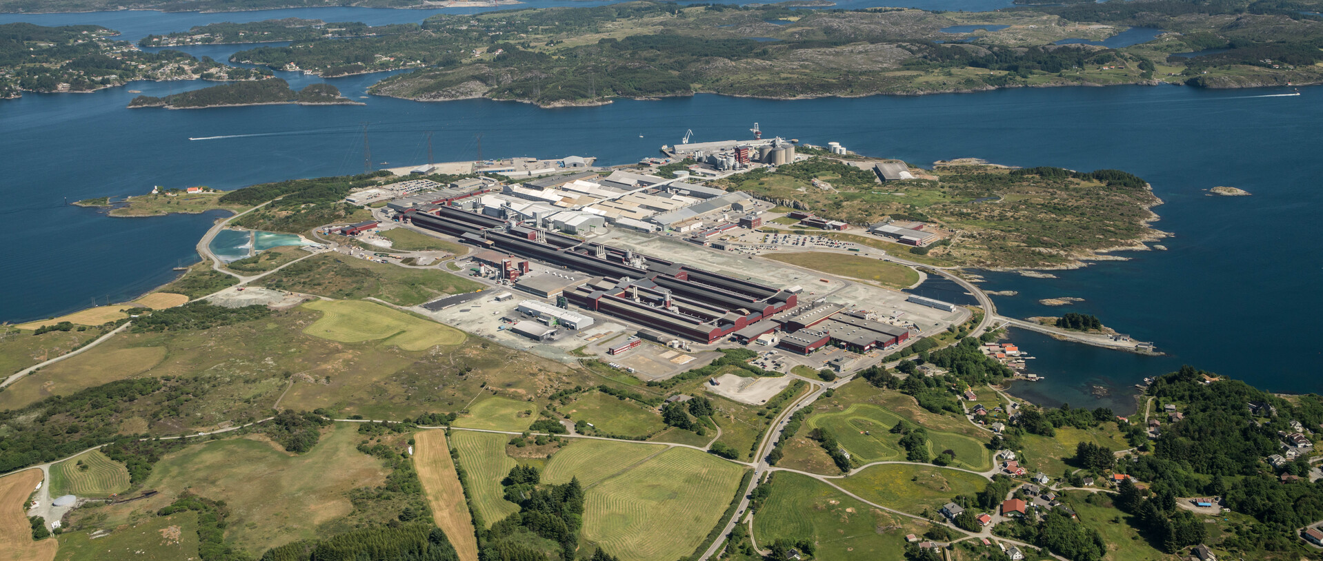 a factory next to a body of water