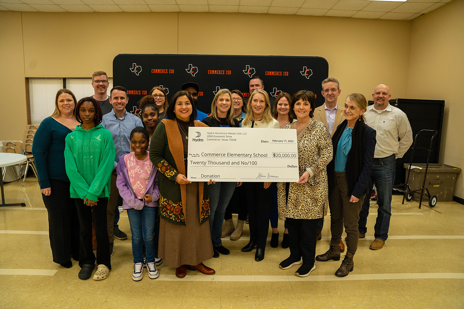 a group of people holding a sign