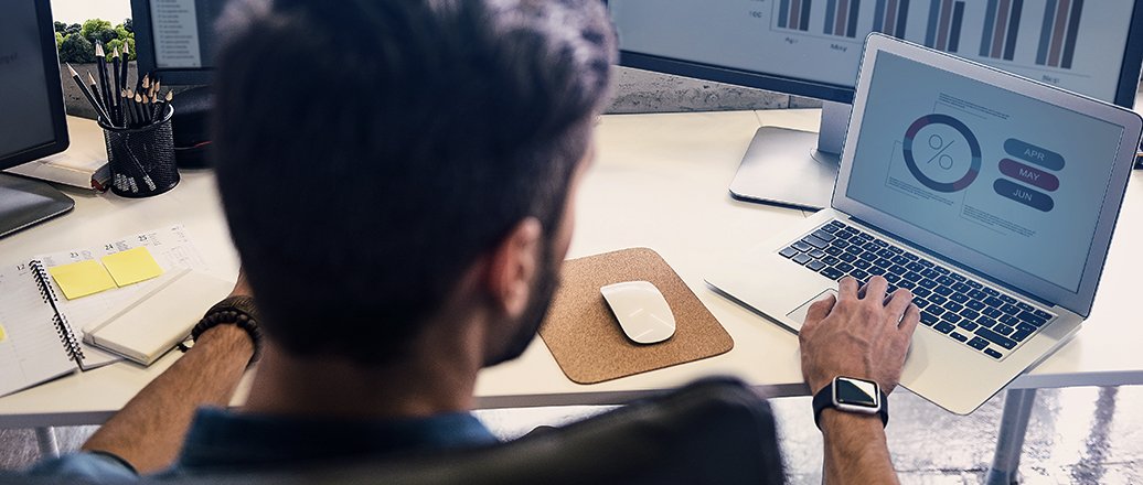 Worker at desk with laptop