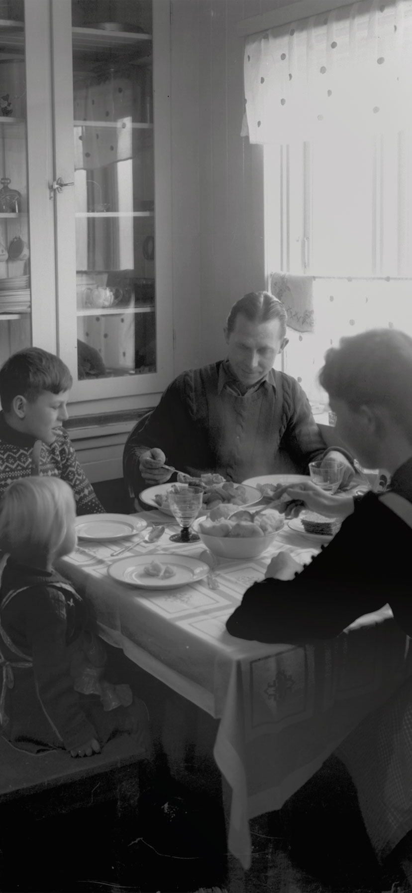 Family having dinner at the kitchen table