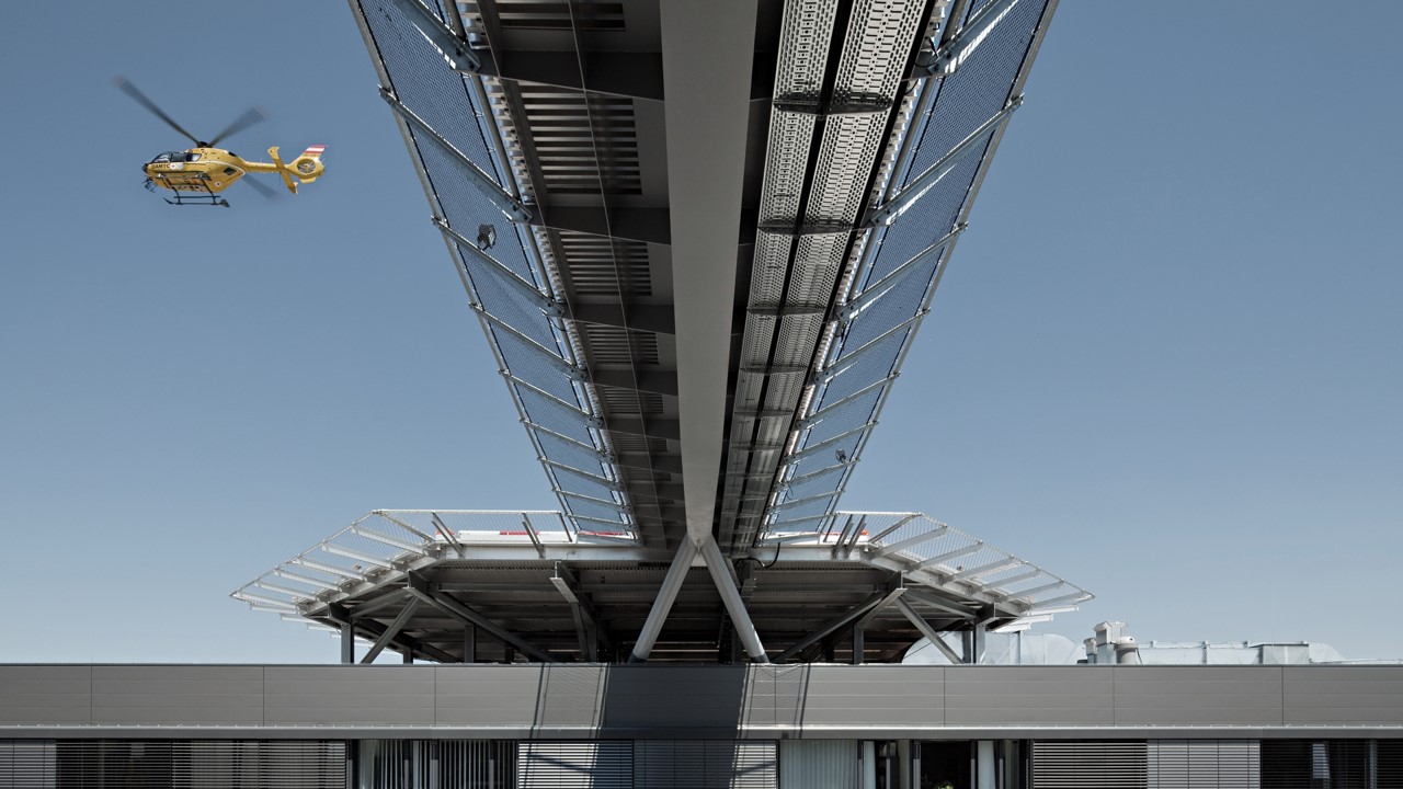 a helicopter flying over a building