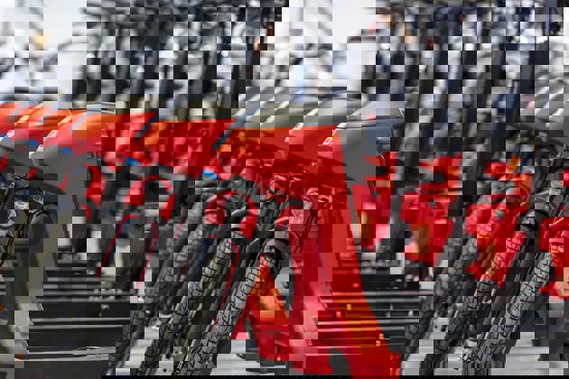 a red motorcycle with a black seat